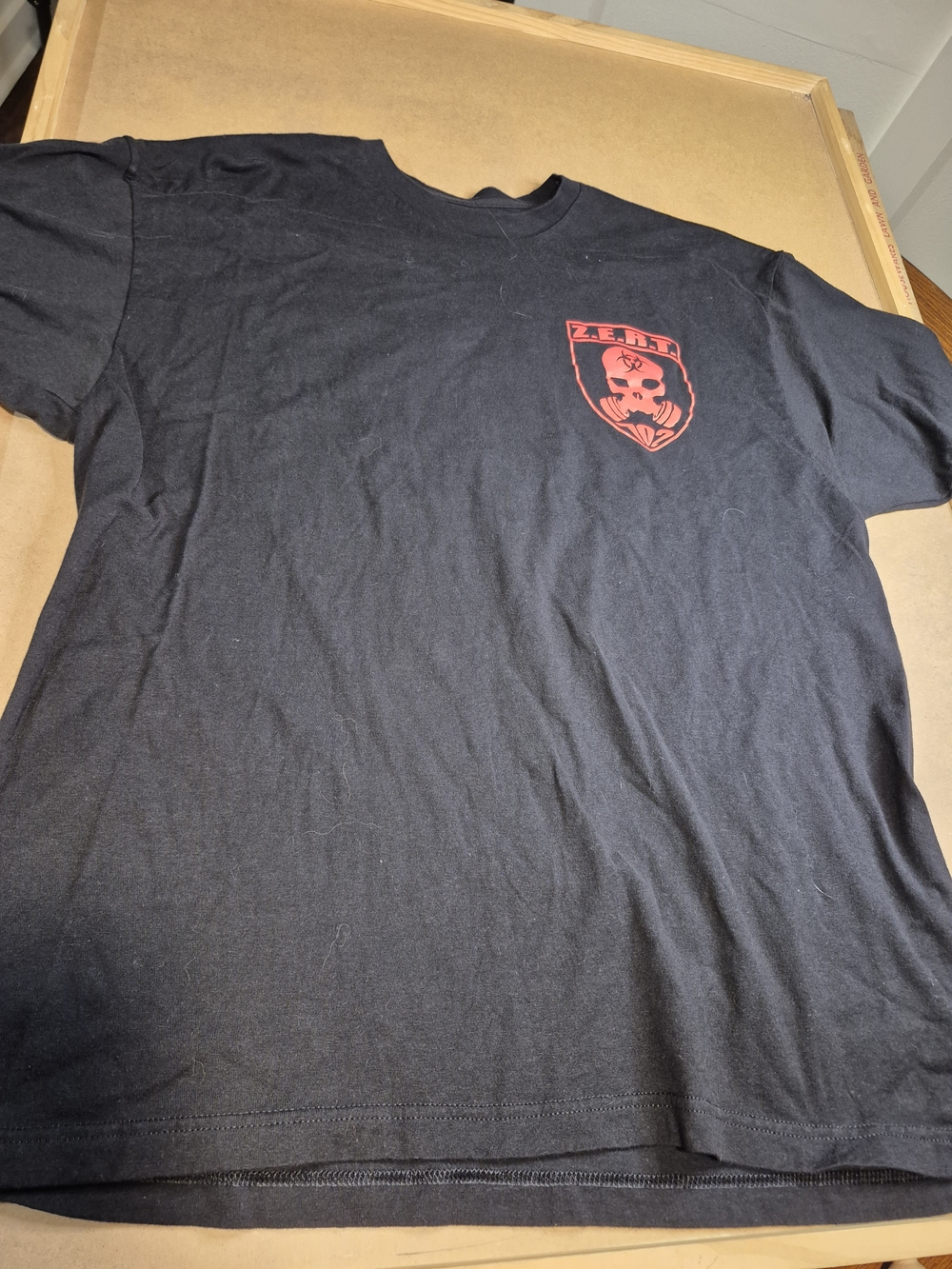Men’s Black Short-Sleeve Tee with Red Crest Graphic